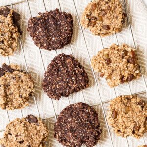 Light and dark brown oatmeal cookies on a wire rack.