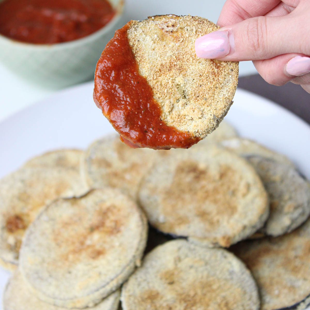 Eggplant cutlet dipped in tomato sauce. 
