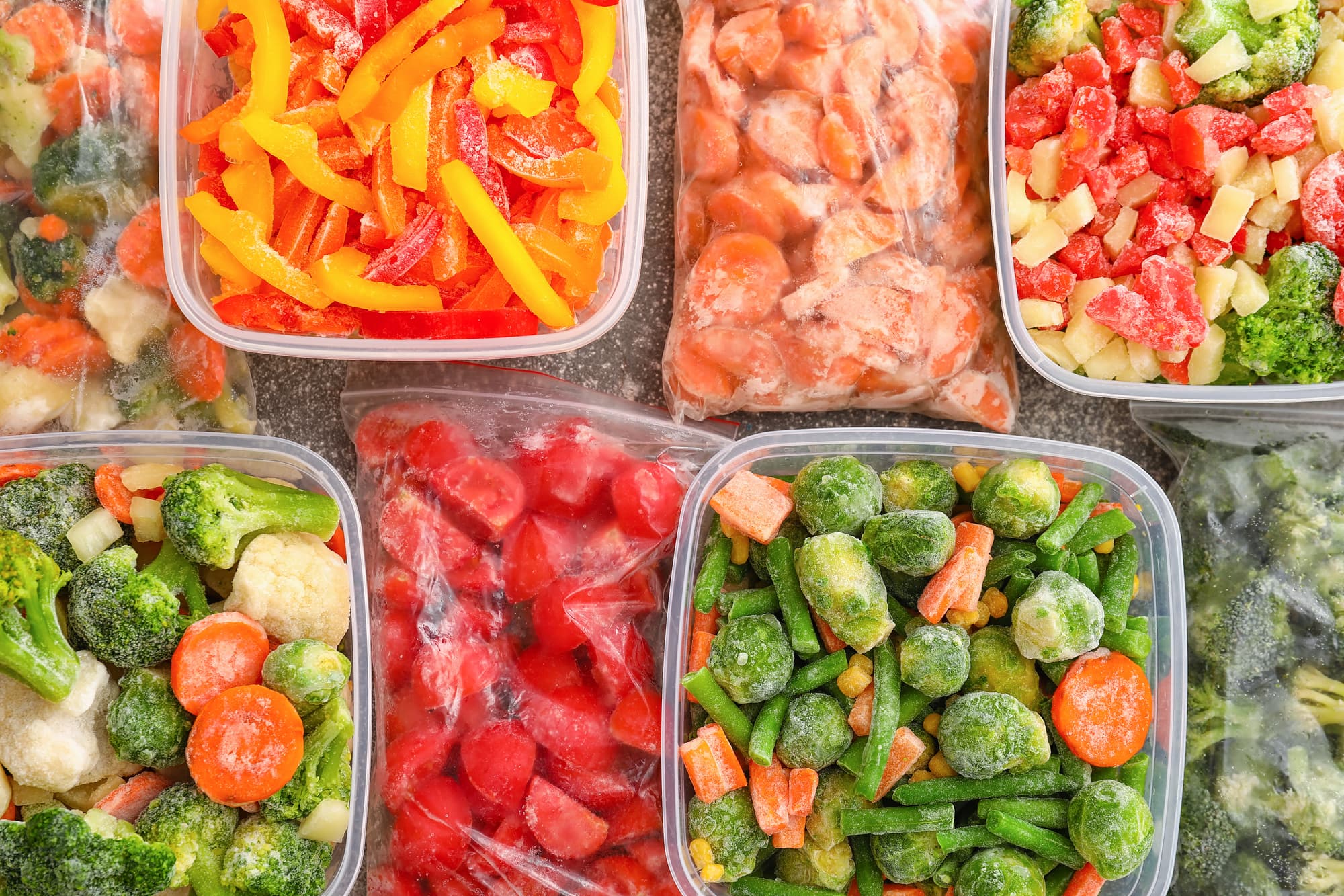 Frozen vegetables in plastic containers or ziplock bags like sliced carrots, broccoli, green beans, bell pepper strips