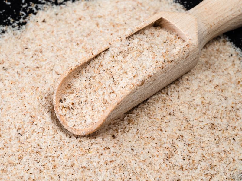 Light brown flakes with a wooden spoon.