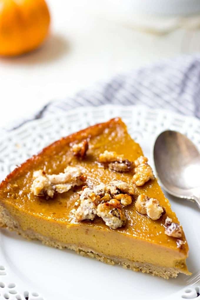 Pumpkin caramel pie on a white plate.