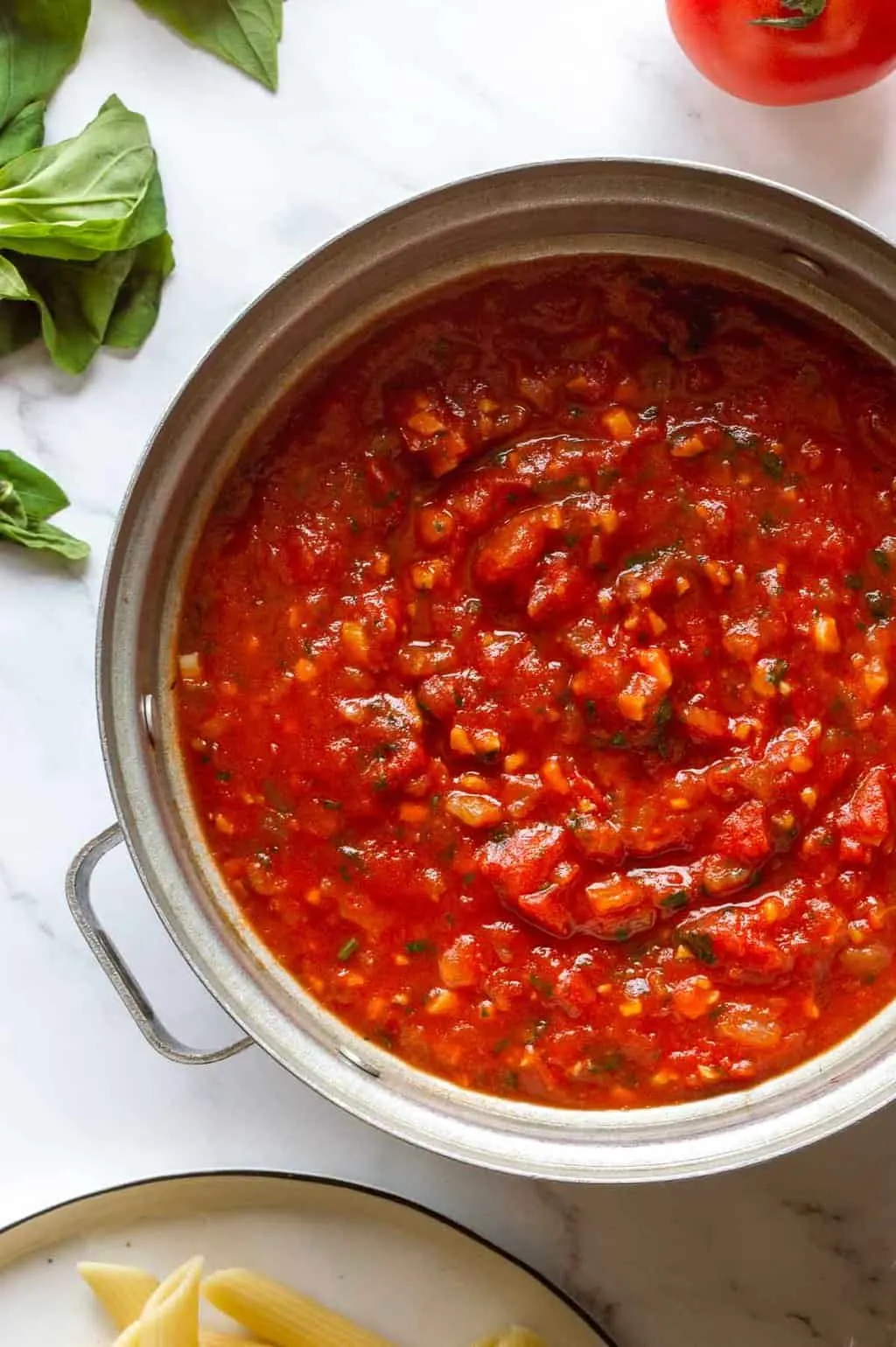 Silver stockpot with red sauce